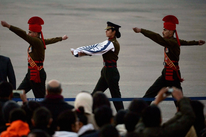 A woman officer of the army carries the national flag ceremony at Vijay Chowk in New Delhi