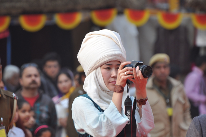 An visitor clicking photos at the Surajkund International Crafts Mela in Faridabad in Haryana on February 6