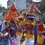 Artistes perform the traditional Gangaur dance during a Shiv Barat procession on the occasion of Mahashivratri in Bhopal