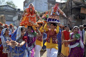 Artistes perform the traditional Gangaur dance during a Shiv Barat procession on the occasion of Mahashivratri in Bhopal