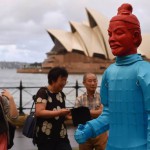 Visitors look at lanterns in the shape of the Chinese Terracotta Warriors at Sydney Harbour on February 13, 2015. The artworks, created for the Beijing Olympic Games in 2008 by a team of Chinese artists, is on display for the first time in Australia to launch the Australian celebrations of the Lunar New Year of the Sheep