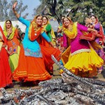 College girls perform gidha around a bonfire as they celebrate Lohri in Patiala