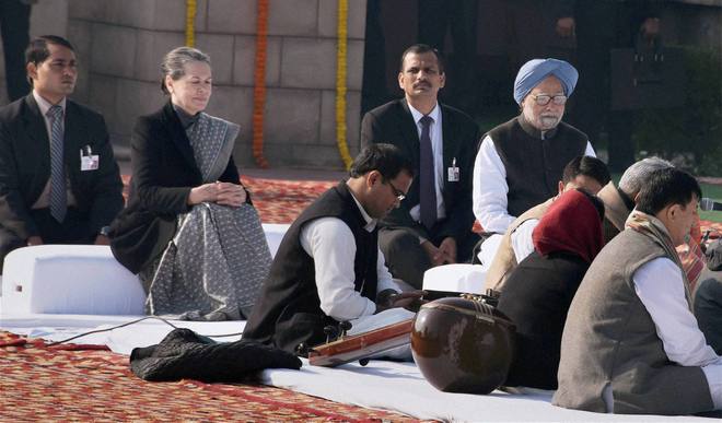 Former PM Manmohan Singh and Congress president Sonia Gandhi attending a function to pay tributes to Mahatma Gandhi on his death anniversary, observed as Martyrs' Day, at Rajghat in New Delhi on January 30, 2015
