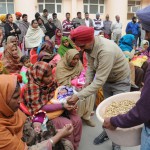 Groundnuts and rewris distributed among people on the occasion of Lohri outside Civil Hospital in Bathinda