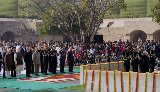 President Pranab Mukherjee along with other dignitaries paying tributes to Mahatma Gandhi on his death anniversary, observed as Martyrs' Day, at Rajghat in New Delhi on January 30, 2015