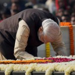 Prime Minister Narendra Modi paying tributes to the Father of the Nation, Mahatma Gandhi, on his death anniversary, observed as Martyrs' Day, at Rajghat in New Delhi on January 30, 2015