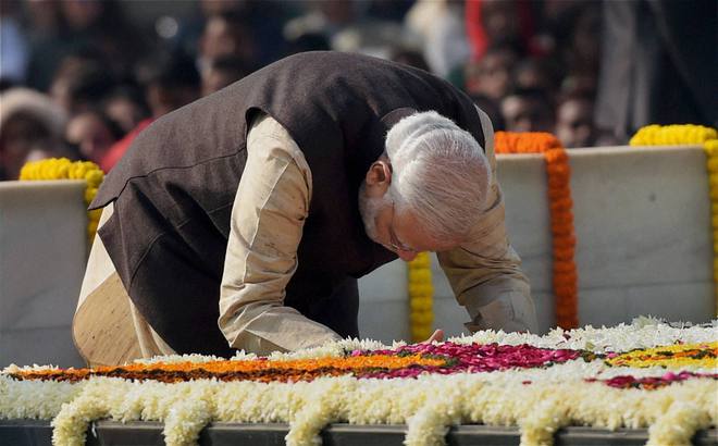 Prime Minister Narendra Modi paying tributes to the Father of the Nation, Mahatma Gandhi, on his death anniversary, observed as Martyrs' Day, at Rajghat in New Delhi on January 30, 2015