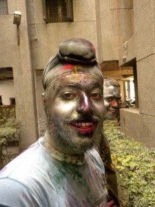 Sikh youth with friends celebrating Holi festival