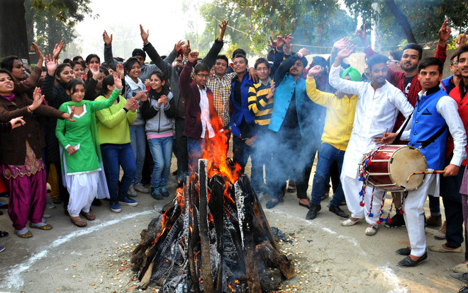 Students celebrate Lohri at Guru Nanak Dev University College Ladowali Road Jalandhar