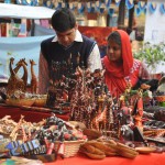 Visitors at stalls at the Surajkund International Crafts Mela in Faridabad in Haryana on February 6