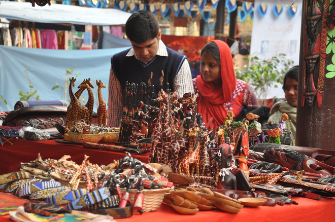 Visitors at stalls at the Surajkund International Crafts Mela in Faridabad in Haryana on February 6