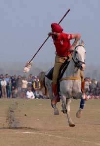 A policeman showing his tent pegging skills on the concluding day of the 79th Kila Raipur Sports Festival at Kila Raipur village, Ludhiana