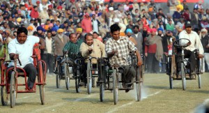 A tricycles race in progress on the concluding day of the 79th Kila Raipur Sports Festival at Kila Raipur village, Ludhiana