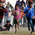 Athletes in action during 100m race at 79th Kila Raipur Sports Festival at Kila Raipur village, Ludhiana