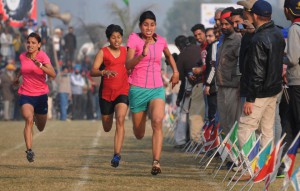 Girls taking part in 800m race on the concluding day of the 79th Kila Raipur Sports Festival at Kila Raipur village, Ludhiana