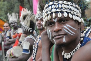 Tribal artists from Gujarat strike a pose on the inaugural day of the three day Rose Festival at the Rose Garden Sector 16 in Chandigarh