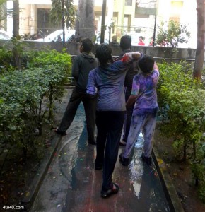 Children play Holi in groups