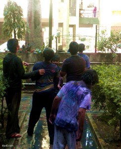 Children play holi in groups