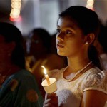 Christian devotees at midnight mass on Easter at Santhome church in Chennai