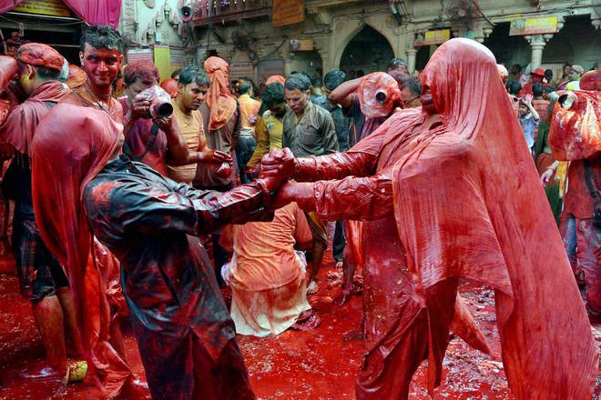 Devotees celebrate Lathmaar Holi at Sriji Temple, Barsana, Mathura
