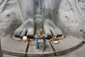 Jain followers pray at Gommateshvara Bahubali at Shravanabelagola