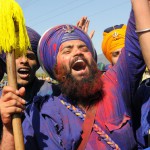 Nihangs play with colors during the ongoing Holla Mohalla celebrations at Anandpur Sahib