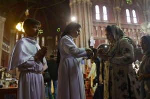 Pakistani Christian devotees attend a service marking Easter at Sacred Heart Cathedral in Lahore