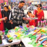 People buy sprinklers pichkaris and colours ahead of the Holi Festival in Bathinda