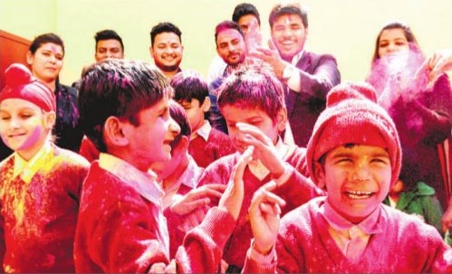 Students of the Institute for Blind Sector 26 take part in the Holi celebrations in Chandigarh