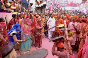 Women of Barsana beating men of Nandgaon with sticks during Lathmaar Holi celebration in Barsana, Mathura