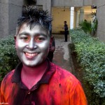 Children face with metallic colors of Holi