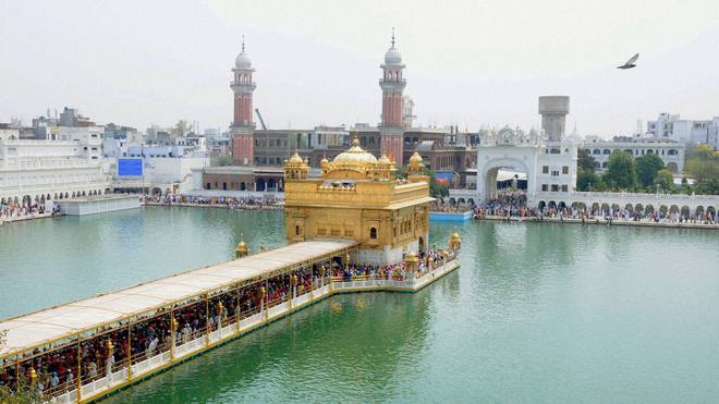 Devotees pay obeisance at Golden Temple on Baisakhi at Amritsar on April 14, 2015