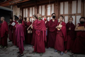 Nepalese Buddhist monks gather for Buddha Purnima celebrations near the Boudhanath stupa in Kathmandu on May 4, 2015.