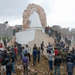 Nepalese rescue team and onlookers gather at the collapsed Darahara Tower in Kathmandu on April 25, 2015