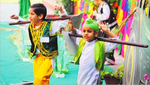 Schoolchildren dressed up in their traditional best present a cultural programme to celebrate the Baisakhi festival