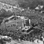 A crowd attends Victory Loan ceremonies at noon at Ottawa's Victory Loan indicator on Victory Island, in Ottawa, Ontario, May 8, 1945
