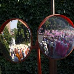 Buddhist monks (L) and believers (R) marching with lotus lanterns are reflected on traffic mirrors during a lotus lantern parade in celebration of the upcoming birthday of Buddha in Seoul, South Korea, on May 16, 2015. Buddha's birthday is commemorated on May 25 in South Korea.