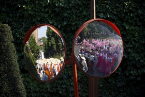 Buddhist monks (L) and believers (R) marching with lotus lanterns are reflected on traffic mirrors during a lotus lantern parade in celebration of the upcoming birthday of Buddha in Seoul, South Korea, on May 16, 2015. Buddha's birthday is commemorated on May 25 in South Korea.