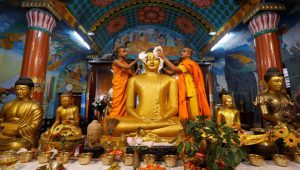 Buddhist monks clean a statue of Lord Buddha inside a temple ahead of the Buddha Purnima festival, also known as Vesak Day, in Kolkata. Buddha Purnima is a festival celebrated with great fervour in countries like India, Sri Lanka, Nepal, Bhutan, Burma, Thailand, Tibet, China, Korea, Laos, Vietnam, Mongolia, Cambodia, Singapore and Indonesia.