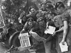 Gunners of the 12th Field Regiment, Royal Canadian Artillery (RCA), are shown with the Victory issue of the Maple Leaf newspaper, in Aurich, Germany, on May 20, 1945, in this handout photo provided by Library and Archives Canada. Seventy years ago, following the suicide of Nazi leader Adolf Hitler, Germany's head of state Karl Donitz signed his country's surrender to Allied forces in Reims, France on May 7, 1945 and in Berlin on May 8, 1945.