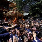 Local residents carry a portable shrine into the Kanda-Myojin shrine during the Kanda festival in Tokyo, Japan, on May 10, 2015.