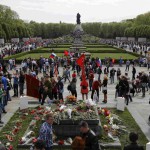 People take part in celebrations to mark Victory Day, at the Soviet War Memorial in Treptower Park in Berlin, Germany, on May 9, 2015.