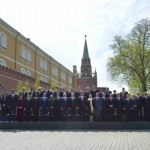 Russian President Vladimir Putin (C), delegation heads and honorary guests pose for a picture in the Alexander Garden on the Victory Day in central Moscow, Russia, on May 9, 2015.