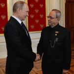 In this handout photograph released by the Indian Presidential Palace on May 9, 2015, Russian President Vladimir Putin (L) shakes hands with Indian President Pranab Mukherjee at the Kremlin in Moscow.