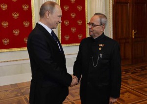 In this handout photograph released by the Indian Presidential Palace on May 9, 2015, Russian President Vladimir Putin (L) shakes hands with Indian President Pranab Mukherjee at the Kremlin in Moscow.
