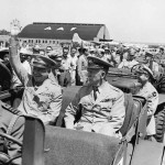 US General Dwight D Eisenhower (L) sits in the back of a jeep with US Army Chief of Staff General George C. Marshall, as he waves to spectators at the Washington National Airport, in Arlington, Virginia, on June 18 1945