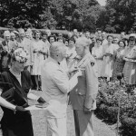 US President Harry S Truman decorates General Dwight D Eisenhower with the Distinguished Service Medal, as his wife Mamie Eisenhower looks on, in Washington on June 18 1945