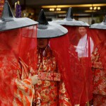 Women in traditional costumes gather before a ritual for the Kanda festival at the Kanda-Myojin shrine in Tokyo on May 9, 2015.