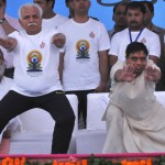 Haryana Chief Minister Manohar Lal Khattar being guided by Bal Krishan (right) at a state a function to mark the International Yoga Day in Karnal on June 15, 2015