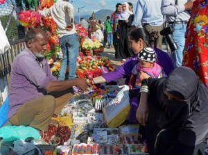 Muslim women shop at a market ahead of the Eid-ul-Adha in Srinagar on September 23, 2015